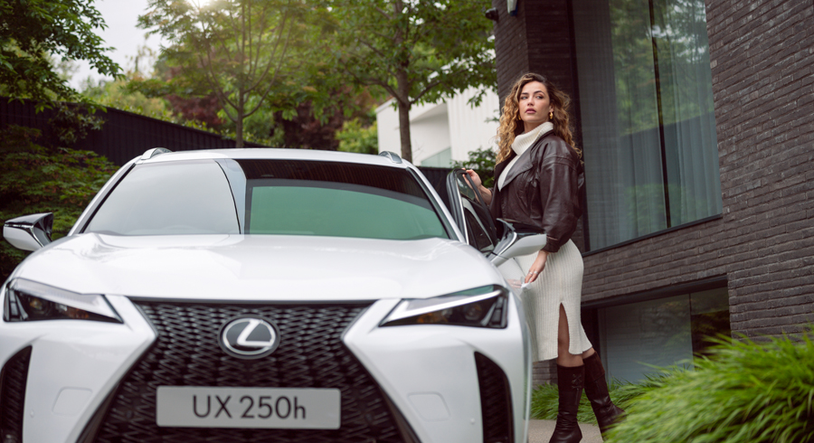 lexus UX 250h car photographed with model outside house